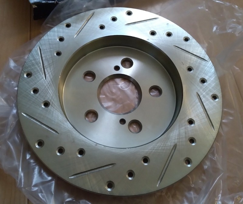 Dynamic Friction 631-76083R - Drilled and Slotted Silver Zinc Brake Rotor gallery