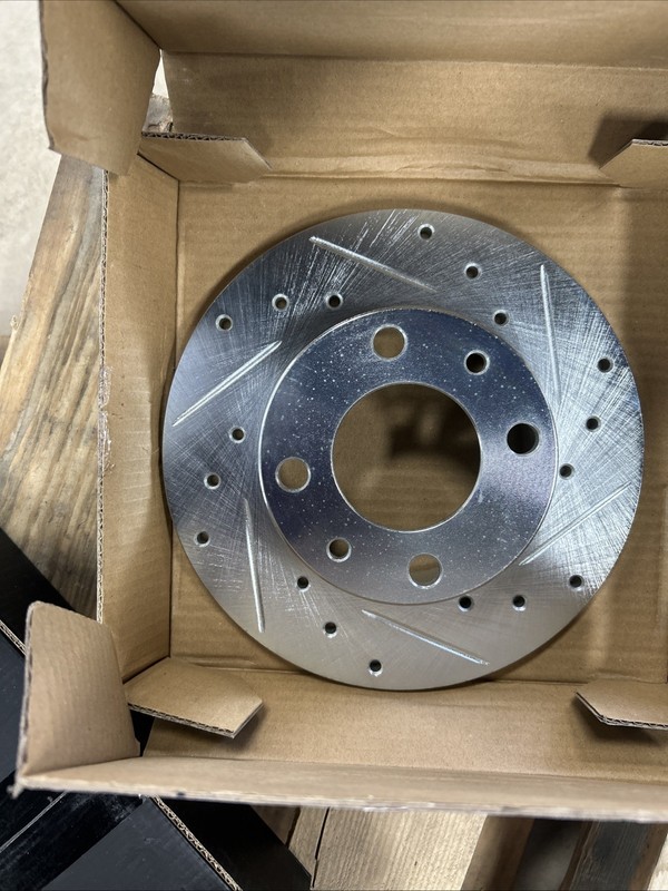 Yugo-Fiat/631-07000L Brake Rotors- Drilled and Slotted. 1551-0054-10 Brake Pads.